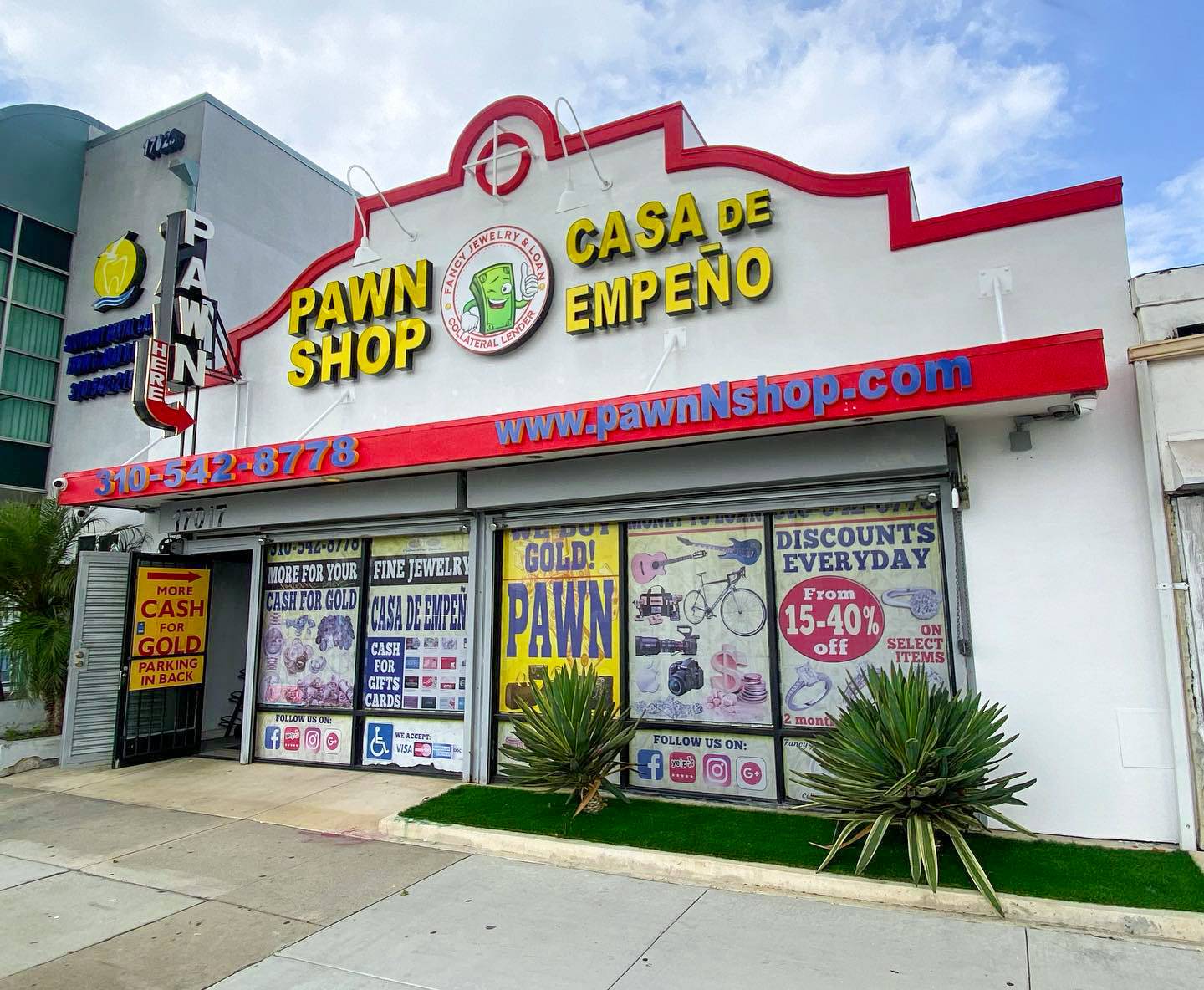 The Fancy Jewelry & Loan Storefront. It Features the Fancy Jewelry & Loan Logo with the Cash Mascot. As well as features the text "Pawn Shop" and "Casa de Empeño"